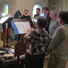 Photo of Father John Onofrey directing the choir