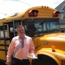 Photo of an attendee outside of God's Chuck Wagon mobile soup kitchen, formerly a yellow school bus