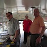 Photo of parishioners inside God's Chuck Wagon mobile soup kitchen, formerly a yellow school bus