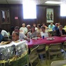 Photo of attendees waiting for the basket raffle to begin