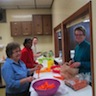 Photo of parishioners cutting up vegetables for the soup