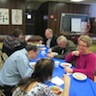 Photo of parishioners and guests enjoying food and fellowship