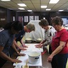 Photo of parishioners rolling out dough during the Pascha baking class