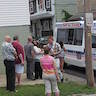 Photo of parishioners lined up at the ice cream truck at the annual_picnic