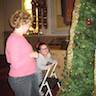 Photo of parishioners decorating the Christmas tree inside the church.