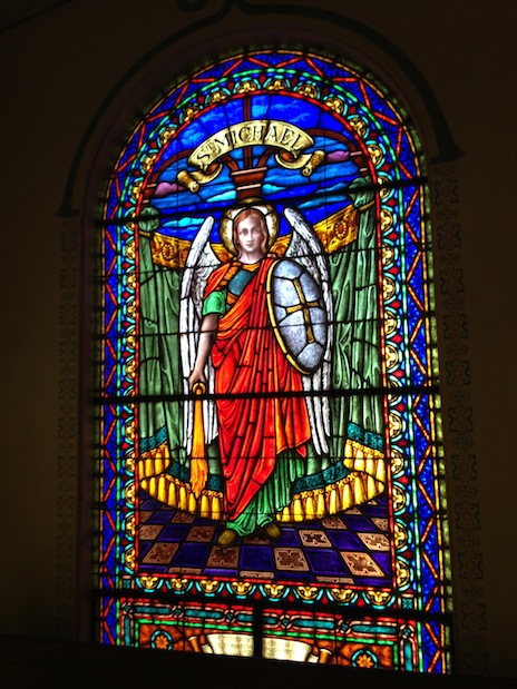Photo of stained glass window depicting St. Michael