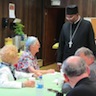 Photo of Bishop Mark with Fr. Edward and family