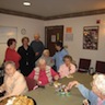 Photo of parishioners visiting with residents of Serenity Gardens