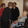 Photo of parishioners visiting with residents of Serenity Gardens