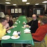 Photo of parishioners speaking with Father Hatfield