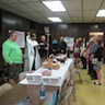 Photo of Fr. Edward blessing dyed eggs Pascha baskets