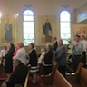 Photo of parishioners queuing for Holy Communion