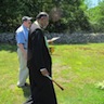 Photo of Fr. Edward blessing graves at Sts. Peter & Paul Cemetery
