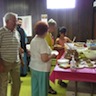 Photo of Father John, Archbishop Mark, and our friends from Divine Redeemer Church