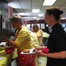 Photo of parishioners getting food during the parish picnic