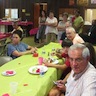 Photo of attendees waiting for the basket raffle to begin