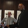 Photo of Father John selecting his door prize