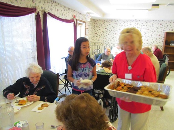Photo of food being served to residents at Serenity Gardens
