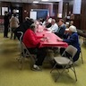 Photo of parish and veterans enjoying a breakfast honoring local veterans