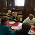 Photo of parish and veterans enjoying a breakfast honoring local veterans