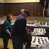 Photo of parish and veterans enjoying a breakfast honoring local veterans