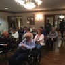 Photo of parish and veterans enjoying a breakfast honoring local veterans