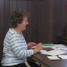 Photo of a parishioner writing out Valentine's Day cards for residents of Serenity Gardens nursing home