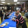 Photo of parishioners and guests enjoying food and fellowship