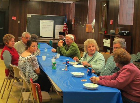 Photo of parishioners and guests enjoying food and fellowship