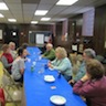 Photo of parishioners and guests enjoying food and fellowship