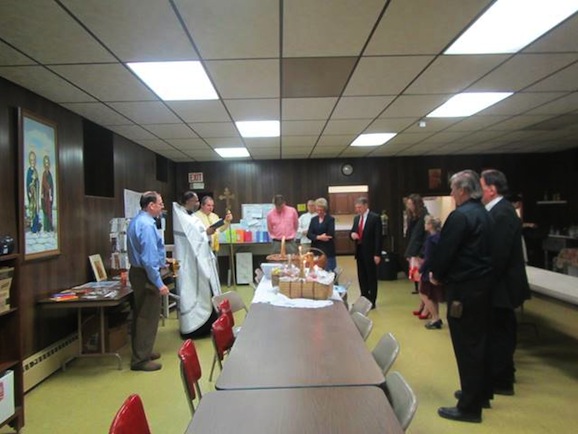 Photo of Father Edward blessing Pascha baskets