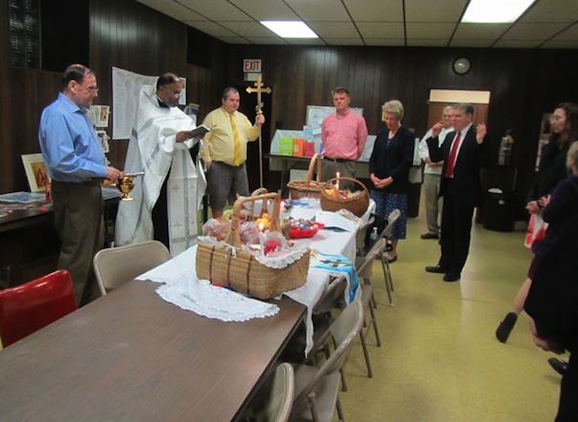 Photo of Father Edward blessing Pascha baskets