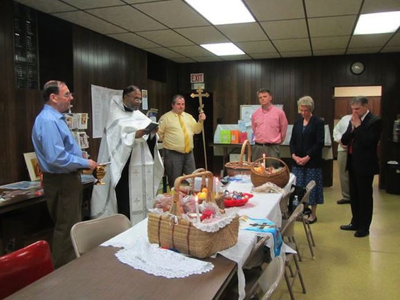 Photo of Father Edward blessing Pascha baskets