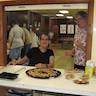 Photo of parishioners baking cookies for residents of Serenity Gardens Nursing Home.