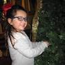 Photo of parishioners decorating the Christmas tree inside the church.