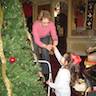 Photo of parishioners decorating the Christmas tree inside the church.