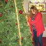 Photo of parishioners decorating the Christmas tree inside the church.