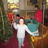 Photo of parishioners decorating the Christmas tree inside the church.