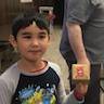 Photo of a young parish boy displaying a gift box he made