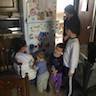 Photo kids putting their names on the refrigerator with magnetic letters after the Prosphora baking class