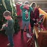 Photo of parishoners decorating the Christmas tree