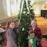 Photo of parishoners in front of the Christmas tree