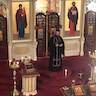 Fr. Vjekoslav is standing in front of the Royal Doors and is speaking to parishoners who are out of the picture's frame.
