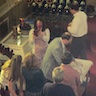 Photo of parisioners taking cups with wine and pieces of bread following Holy Communion during the pascha service
