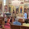 Photo of Father Vjekoslav speaking to parishoners seated in pews