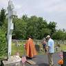 Photo of Father Vjekoslav blessing gravesites at Sts. Peter & Paul Cemetery