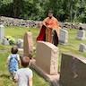 Photo of Father Vjekoslav blessing gravesites at Sts. Peter & Paul Cemetery