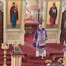 Photo of His Eminence, Archbishop Mark speaking to the parish while standing in front of the iconostas