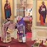 Photo of His Eminence, Archbishop Mark presenting Father Vjekoslav with the Nabedrenik