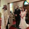 Father Vjekoslav performs the intial part of the ceremony at the back of the church, with the wedding couple standing in the church nave. The bride is wearing a sleeveless white dress, and the groom is wearing a black suit. Both look stunning!